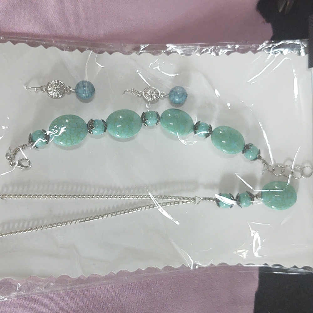 Three piece hand wired turquoise stones accident with silver